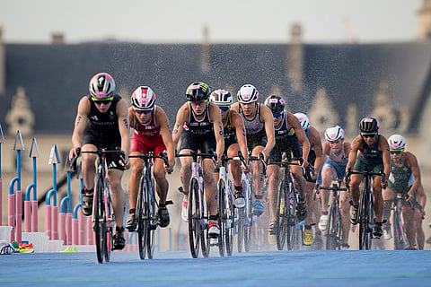 Athletes compete during the bike leg